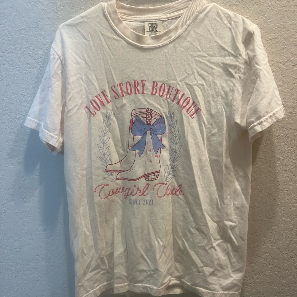 Love Story Boutique White Graphic Tee with Pink and Blue Cowgirl Design